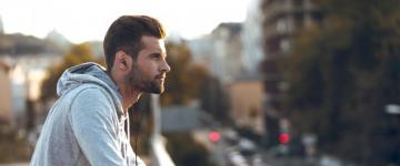 Man sitting and overlooking city