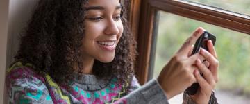 Teen looking at phone